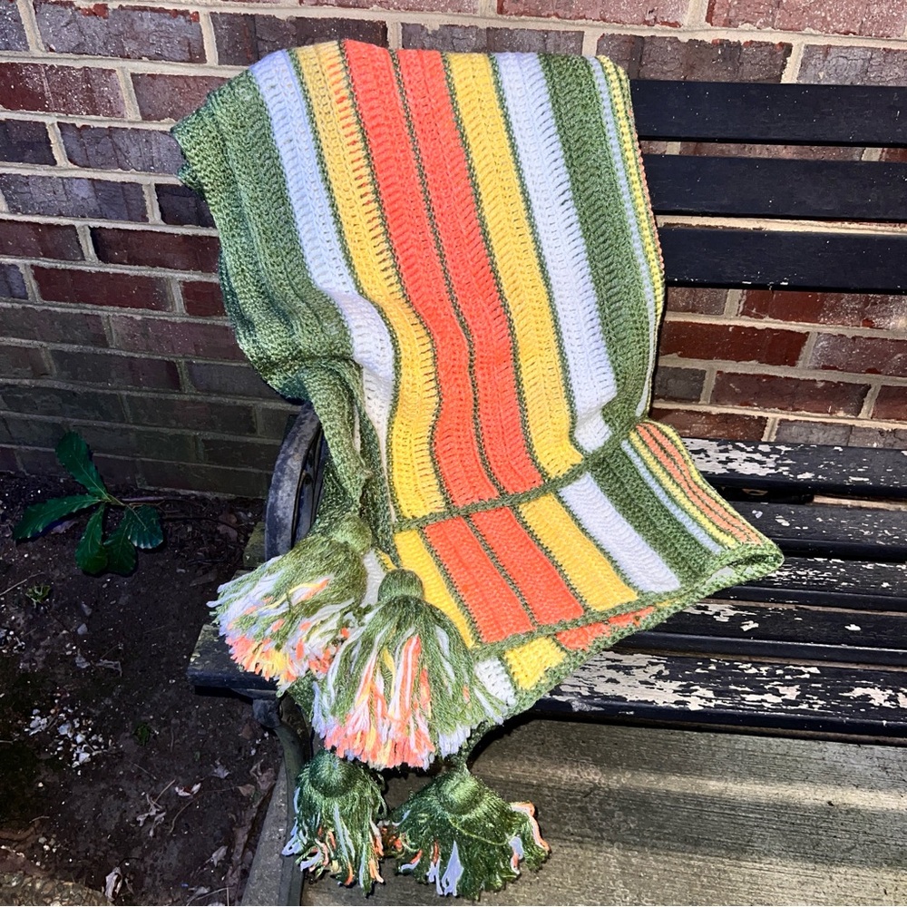 Vintage handmade crochet afghan blanket with tassel corner detail